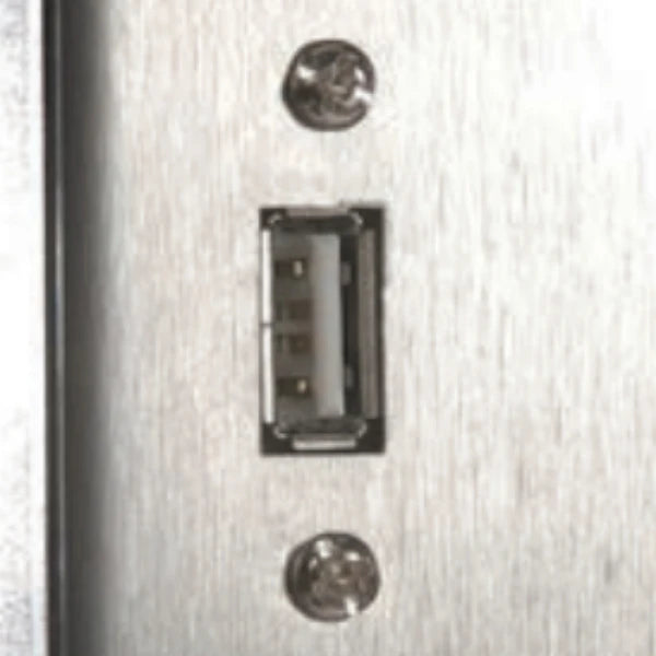 Close-up of a brushed metal panel with a recessed USB-A port secured by two screws.