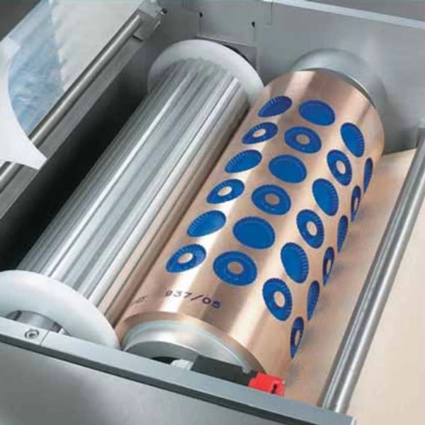 A close-up of a a rotary moulder cookie machines moulding drum. 