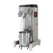 A commercial stand mixer with a stainless steel bowl, wire whisk attachment, and a gray metal body on a white background.