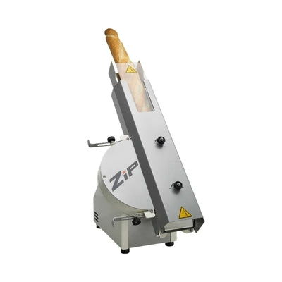 A commercial bread slicing machine with a silver metal body, featuring a loaf of bread in the input slot and the brand name 'Zip' printed on the side, set against a plain white background.