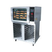 A commercial stainless steel bakery convection oven with a glass door showing baked pastries inside, alongside a digital control panel, and multiple empty metal racks on wheels below, isolated on a white background.