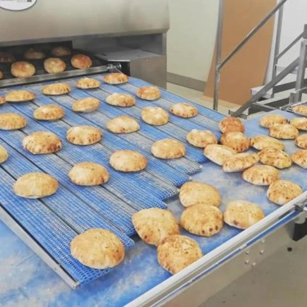 baked products coming out of the exit of a direct fired gas tunnel oven 