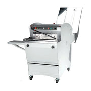 Gravity fed bread slicer with bagging attachment and control panel.