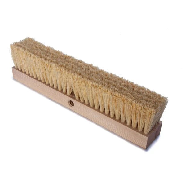 A long rectangular oven brush head with natural tan bristles and a light wood handle, photographed on a plain white background.