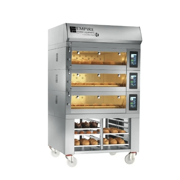 A modular electric commercial deck oven with three upper display windows showing golden baked goods and a lower window with shelves of bread, on a white background.