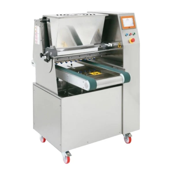 A stainless steel cookie depositor machine with a conveyor belt and touch screen control panel, mounted on a wheeled base with casters, shown against a plain white background.