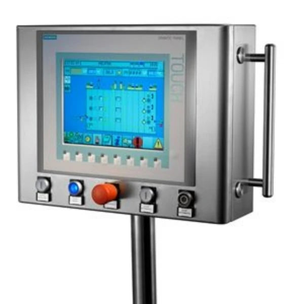 An industrial touchscreen control panel with a brushed metal housing, a vertical handle on the right, and a central stand. The panel features a large blue-lit display screen, a red emergency stop button, and other control buttons below.
