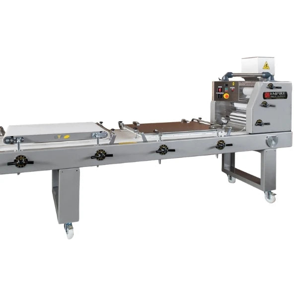 A commercial-grade stainless steel dough roller machine with a conveyor belt system, featuring a control panel, handwheels, and caster wheels on a white background.