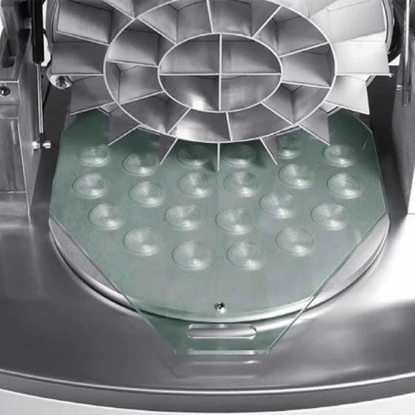 Close-up of a commercial dough divider and rounder, rounding plate and cutters.