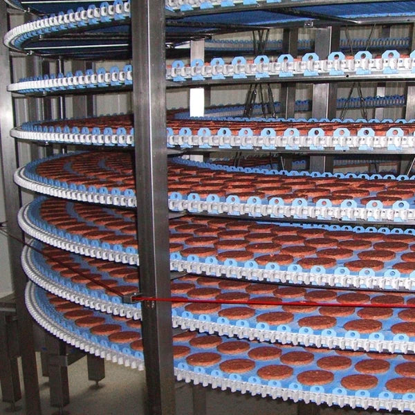 close up of the spiral conveyors within an industrial freezing unit