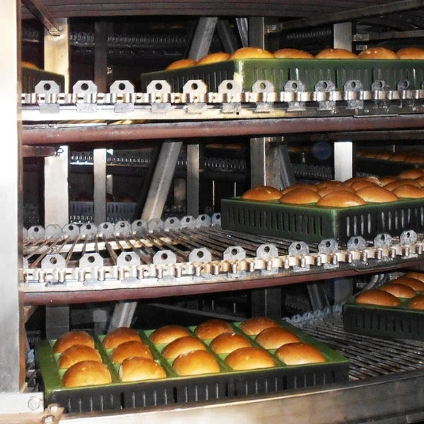 close up of bread being baked inside of a spiral thermal oil oven