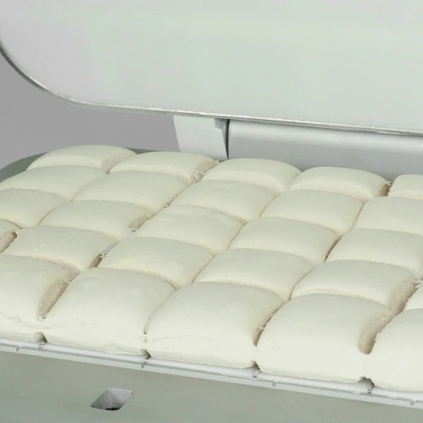 A close-up of a dough after it has been divided by a square commercial dough dividing machine.